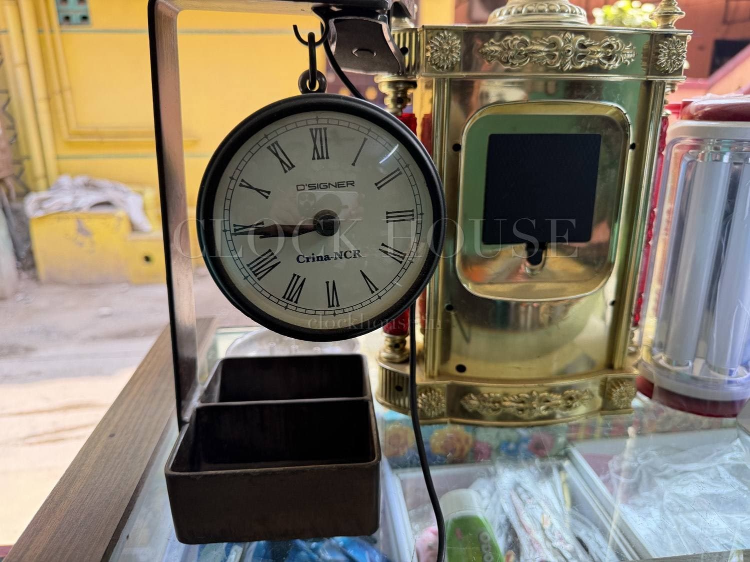 Ornate brass carriage clock at Clock House