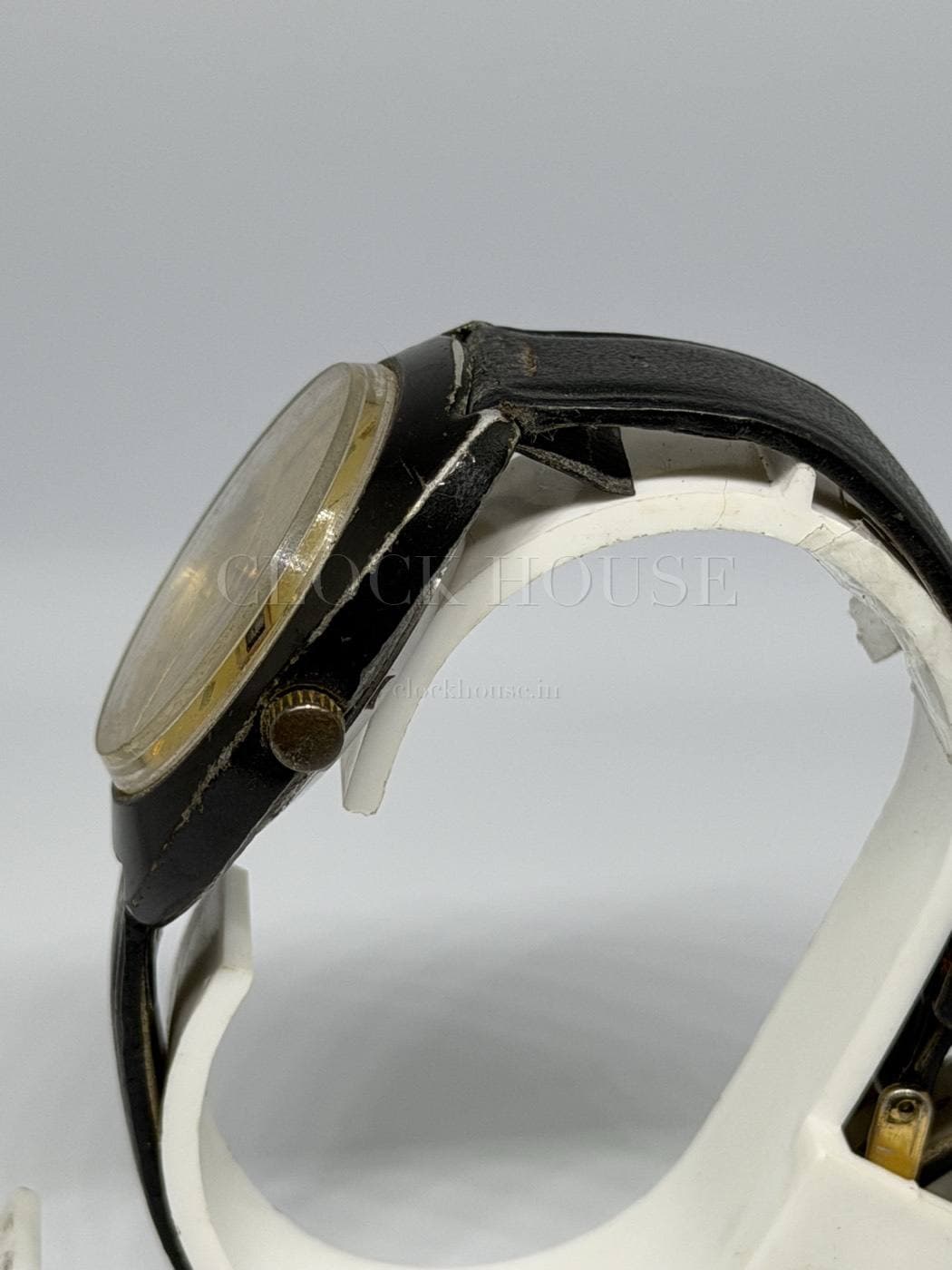 HMT Sourab domed acrylic crystal and signed gold-tone crown in profile