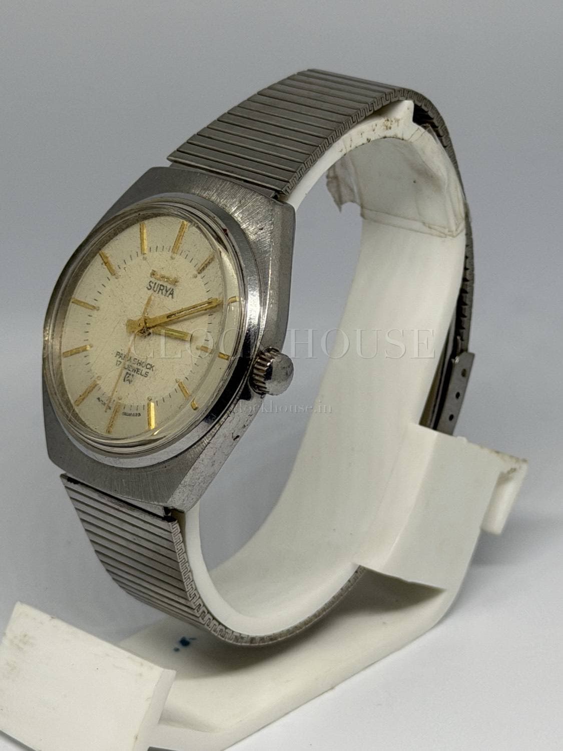 HMT Surya at a three-quarter angle showing the faceted case and crown