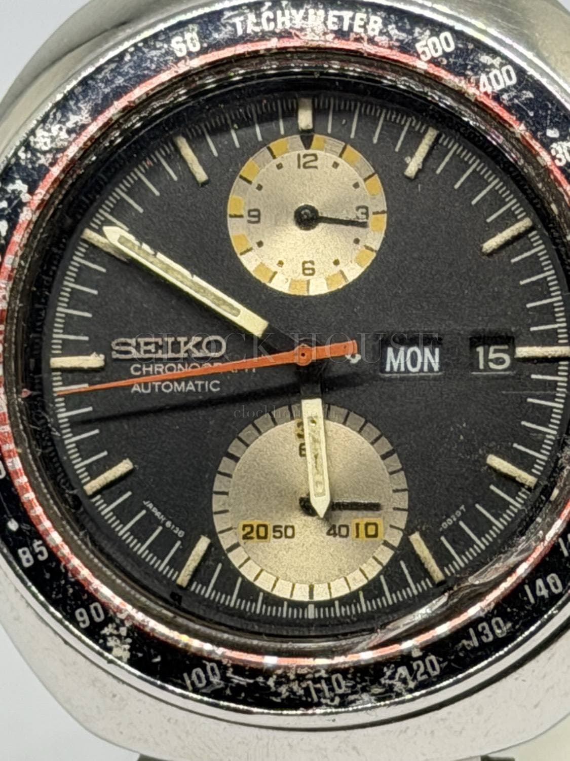Seiko 6138 Jumbo dial close-up: two registers, day-date, orange chronograph seconds